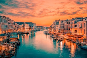 Famous grand canal from Rialto Bridge at blue hour, Venice, Italy. Special photographic processing.