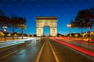 Famous Arc de Triomphe at night, Paris, France.