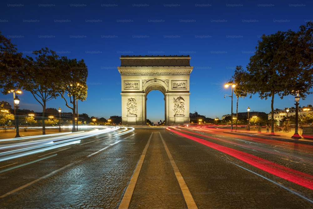 Famous Arc de Triomphe at night, Paris, France.