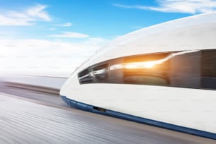 Railroad travel passenger train high speed with motion blur effect, against the blue sky