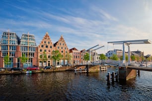 Gravestenenbrug bridge on Spaarne river and old houses in Haarlem, Netherlands