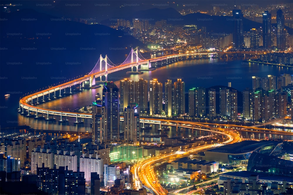 Busan cityscape with skyscrapers and Gwangan Bridge illuminated at night. Busan. South Korea