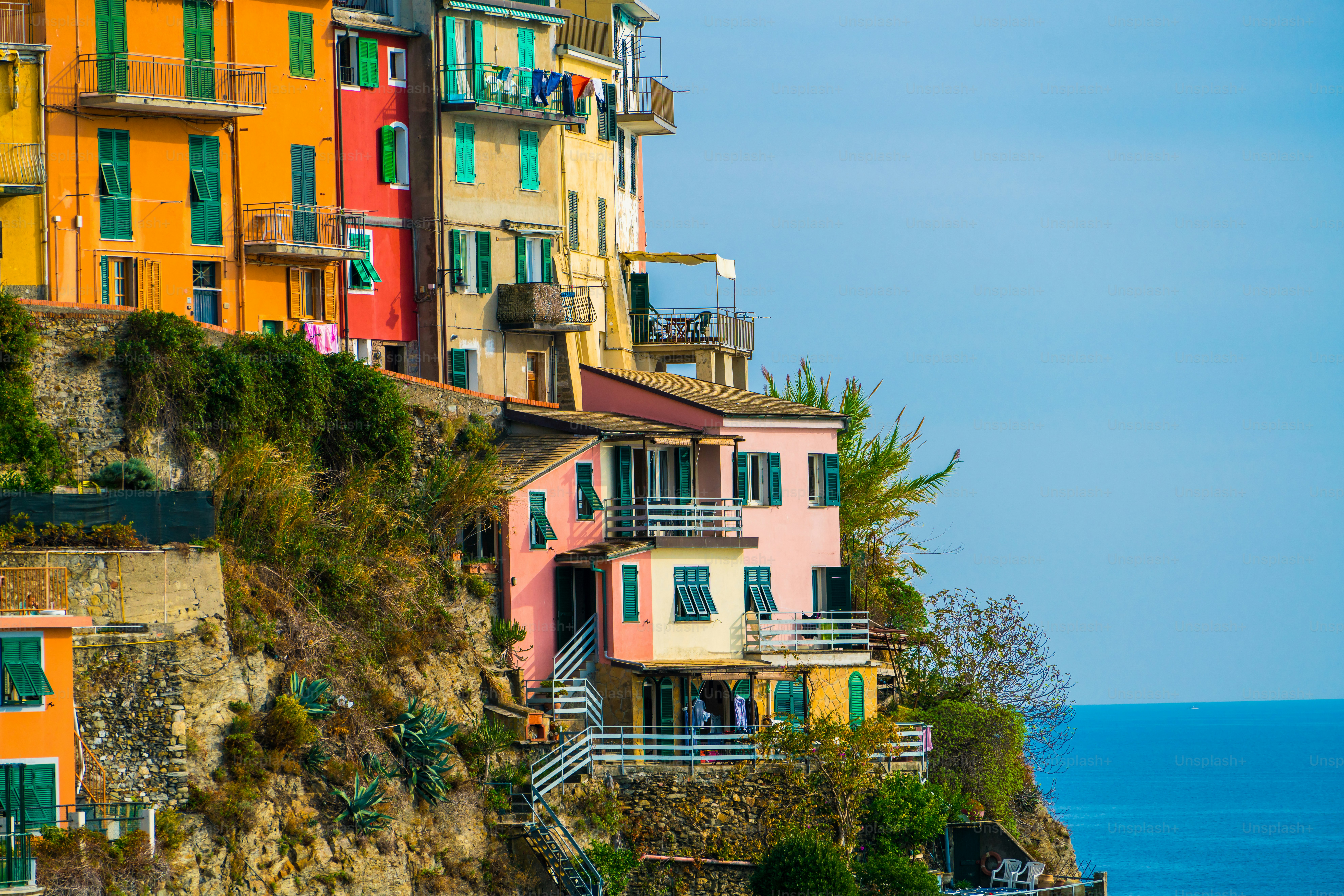 Colorful houses in Manarola Village, Cinque Terre Coast of Italy. Manarola is a beautiful small town in the province of La Spezia, Liguria, north of Italy and one of the five Cinque terre attractions.