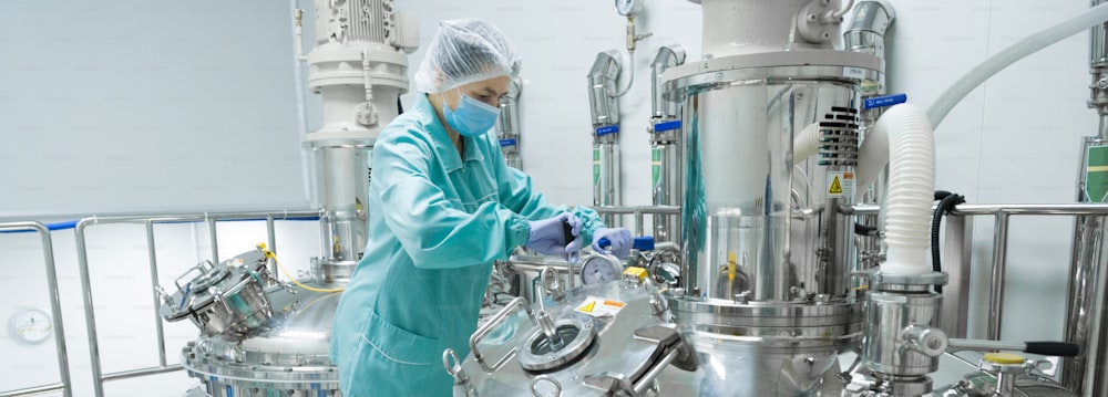 Pharmaceutical technician in sterile environment at pharmacy industry