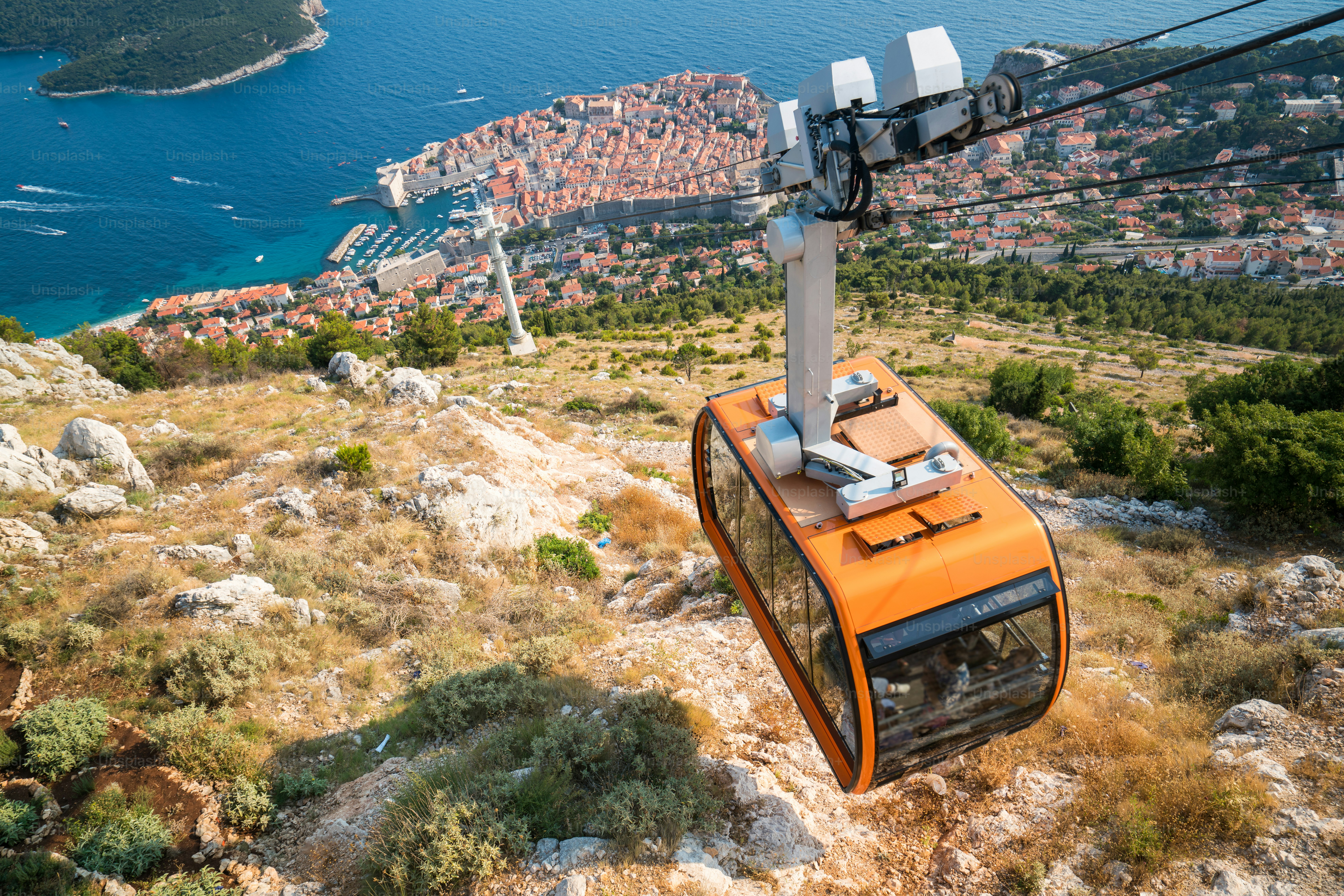 Panorama view of cable car and Dubrovnik Old Town in Dalmatia, Croatia - Prominent travel destination of Croatia. Dubrovnik old town was listed as UNESCO World Heritage Sites in 1979.