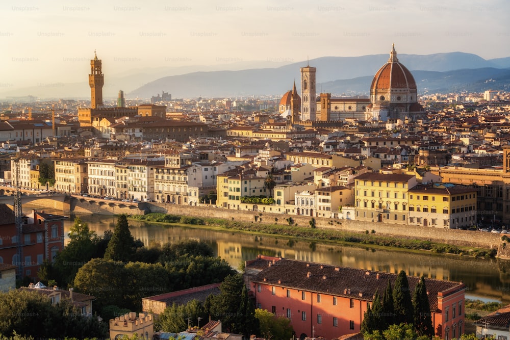 Florence Cathedral (Cattedrale di Santa Maria del Fiore) in historic center of Florence, Italy with panoramic view of the city. Florence Cathedral is the major tourist attraction of Tuscany, Italy.