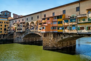 Florence Ponte Vecchio Bridge and City Skyline in Italy. Florence is capital city of the Tuscany region of central Italy. Florence was center of Italy medieval trade and wealthiest cities of past era.