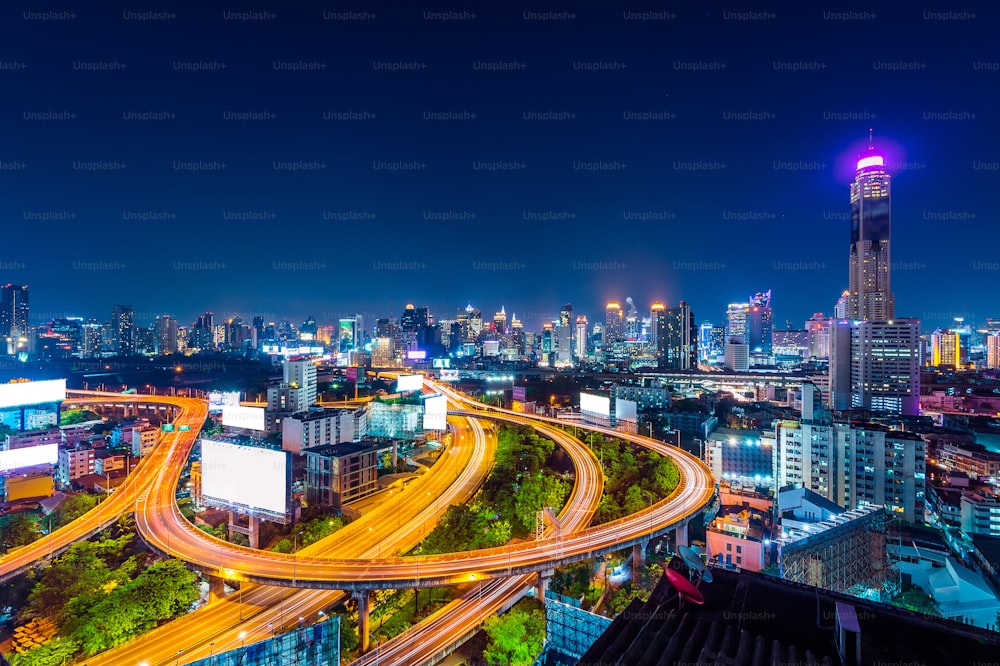 Cityscape and traffic at night in Bangkok, Thailand.