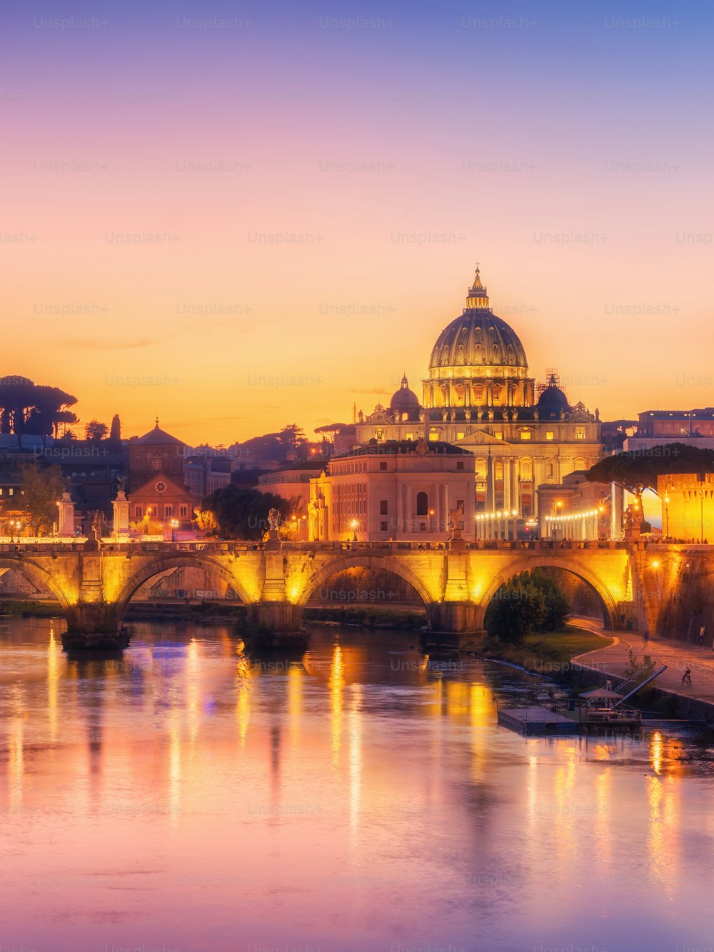 Rome Skyline with Vatican St Peter Basilica and St Angelo Bridge crossing Tiber River in city center of Rome Italy , historical landmarks attraction of the Ancient Rome , travel destination of Italy.