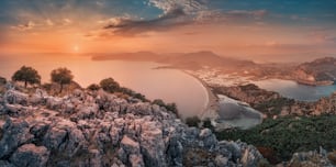 Colorful and majestic sunset over a small Bay in the Mediterranean sea in Turkey. View from the Iztuzu observation point near the city of Dalyan on the river Delta and chain of lakes.