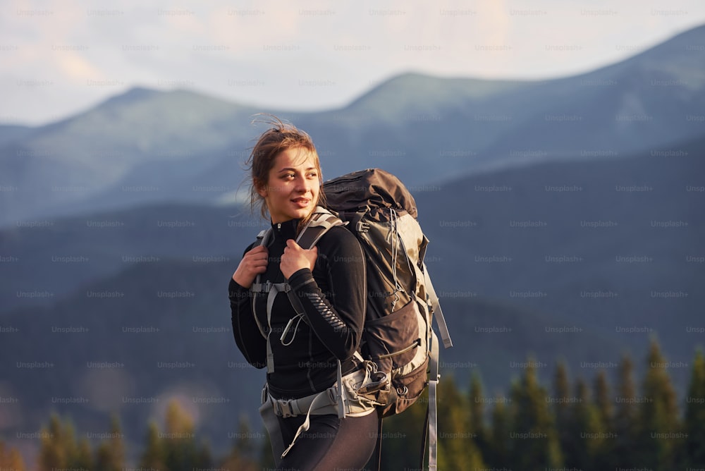 Woman having a walk. Majestic Carpathian Mountains. Beautiful landscape of untouched nature.