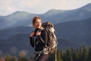 Woman having a walk. Majestic Carpathian Mountains. Beautiful landscape of untouched nature.