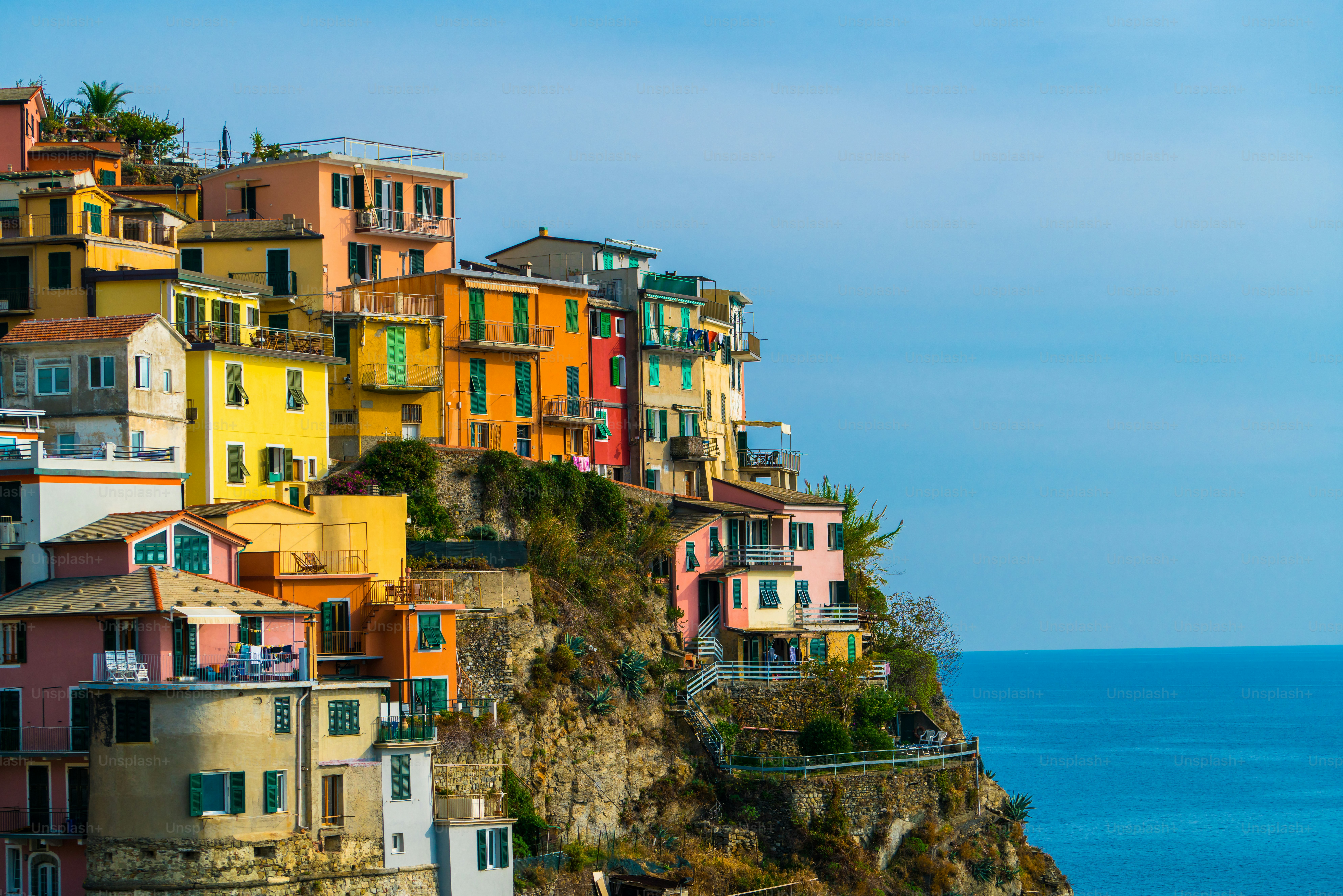 Colorful houses in Manarola Village, Cinque Terre Coast of Italy. Manarola is a beautiful small town in the province of La Spezia, Liguria, north of Italy and one of the five Cinque terre attractions.