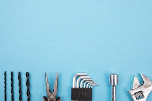Mechanical set of different tools isolated on blue background