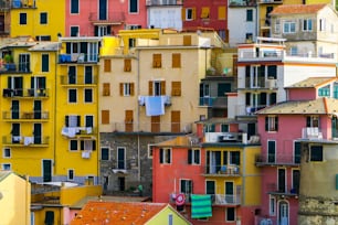 Colorful houses in Manarola Village, Cinque Terre Coast of Italy. Manarola is a beautiful small town in the province of La Spezia, Liguria, north of Italy and one of the five Cinque terre attractions.