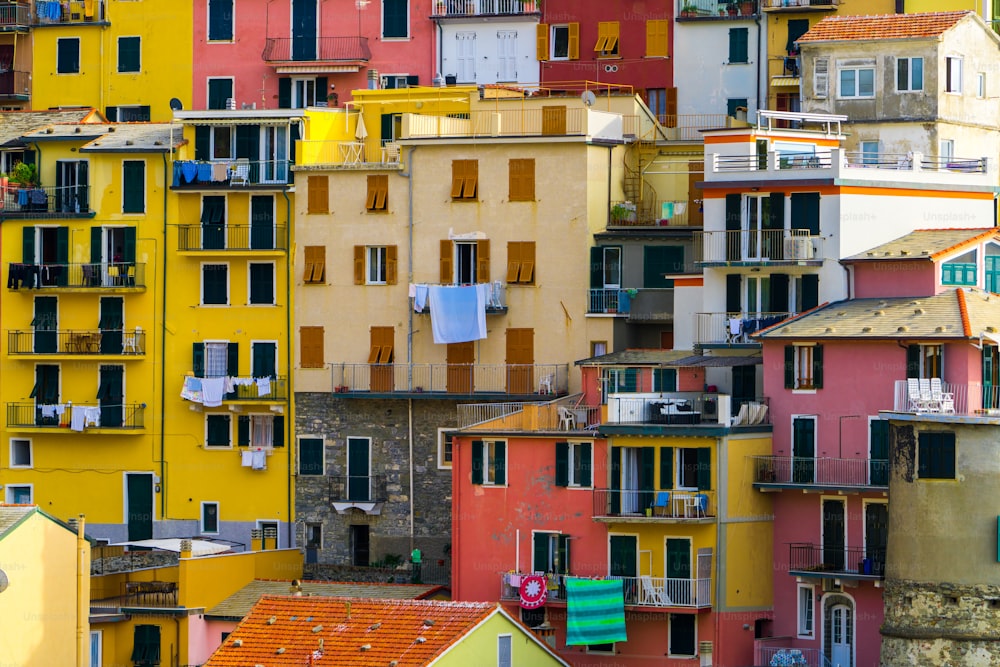 Colorful houses in Manarola Village, Cinque Terre Coast of Italy. Manarola is a beautiful small town in the province of La Spezia, Liguria, north of Italy and one of the five Cinque terre attractions.