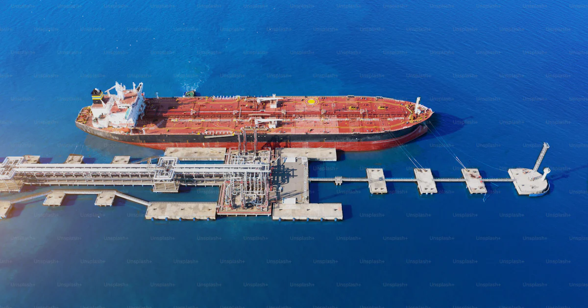 Port Loading Tank Containers Aerial view large port oil loading terminal with large storage tanks ...