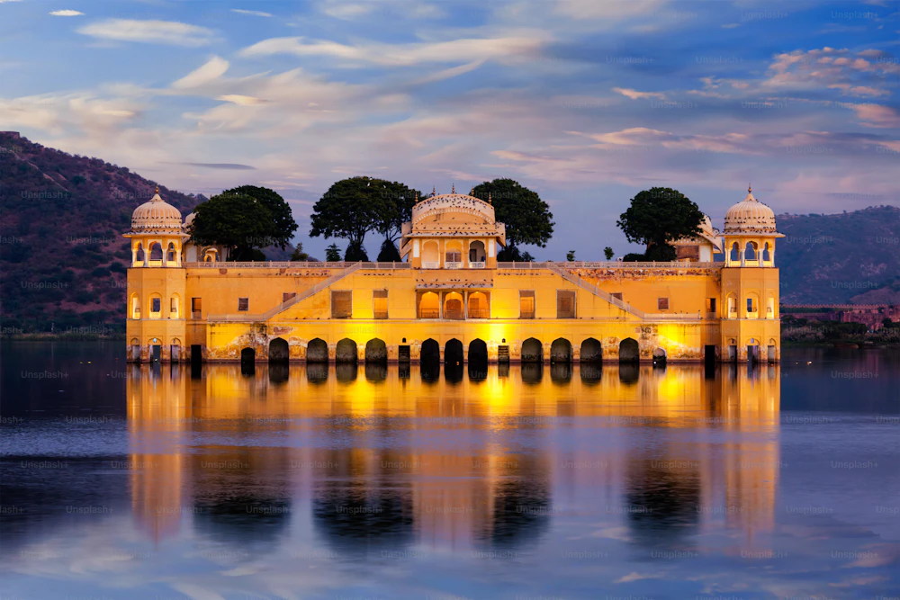 Jal Mahal water palace lit up at dusk on Man Sagar Lake