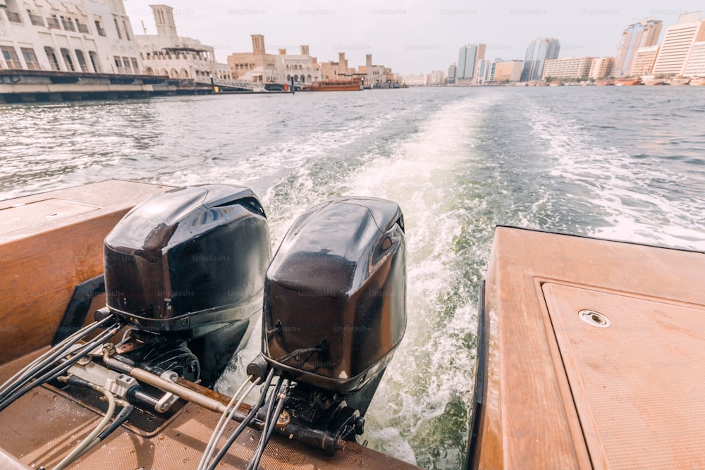 Two powerful engines at the stern of a cruise ferry boat in the Creek Dubai Canal area overlooking the Deira area