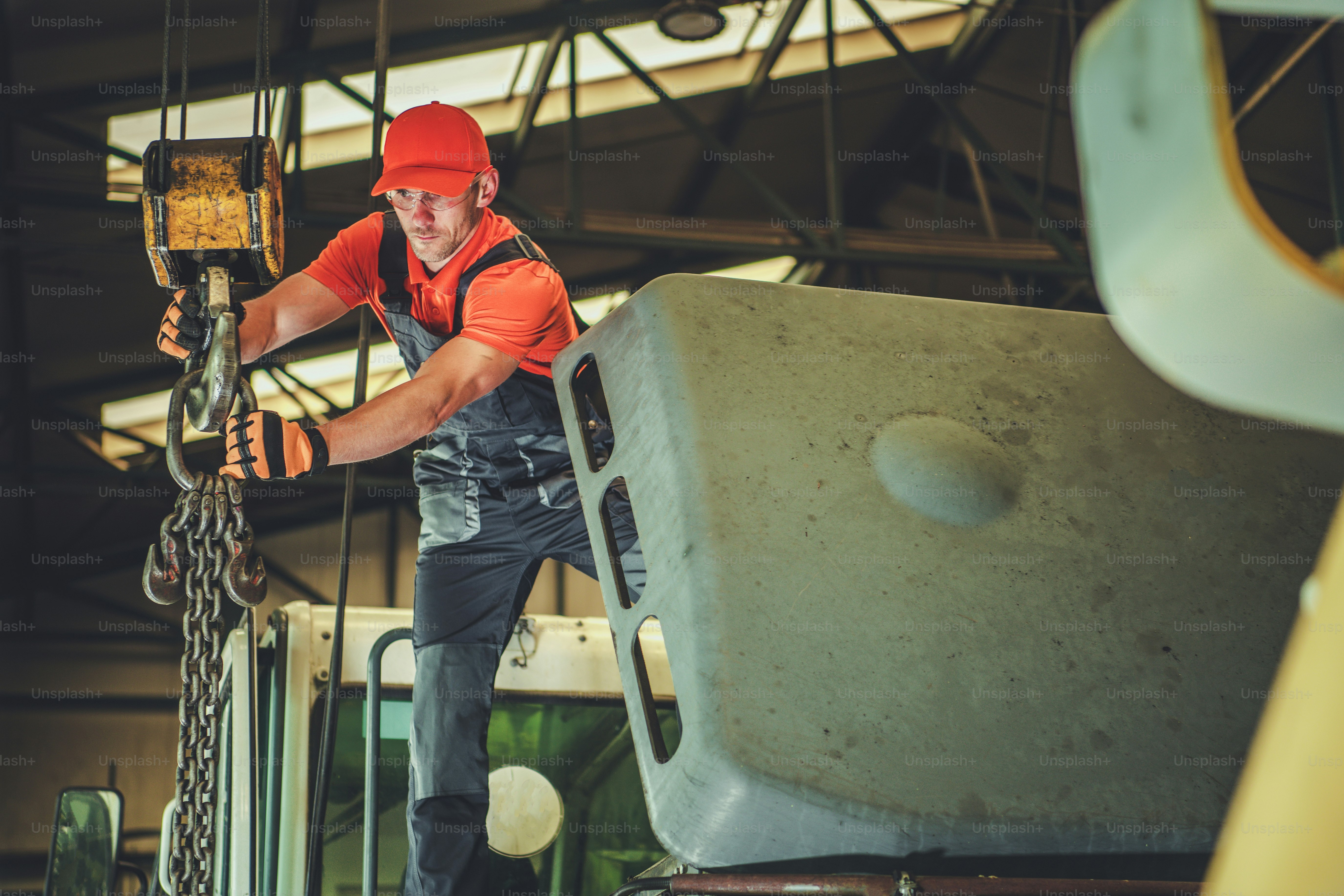 Caucasian Men in His 30s Operating Warehouse Lift. Industrial Theme.