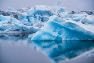 Icebergs in Jokulsarlon beautiful glacial lagoon in Iceland. Jokulsarlon is a famous travel destination in Vatnajokull National Park, southeast Iceland, Europe. Winter landscape.