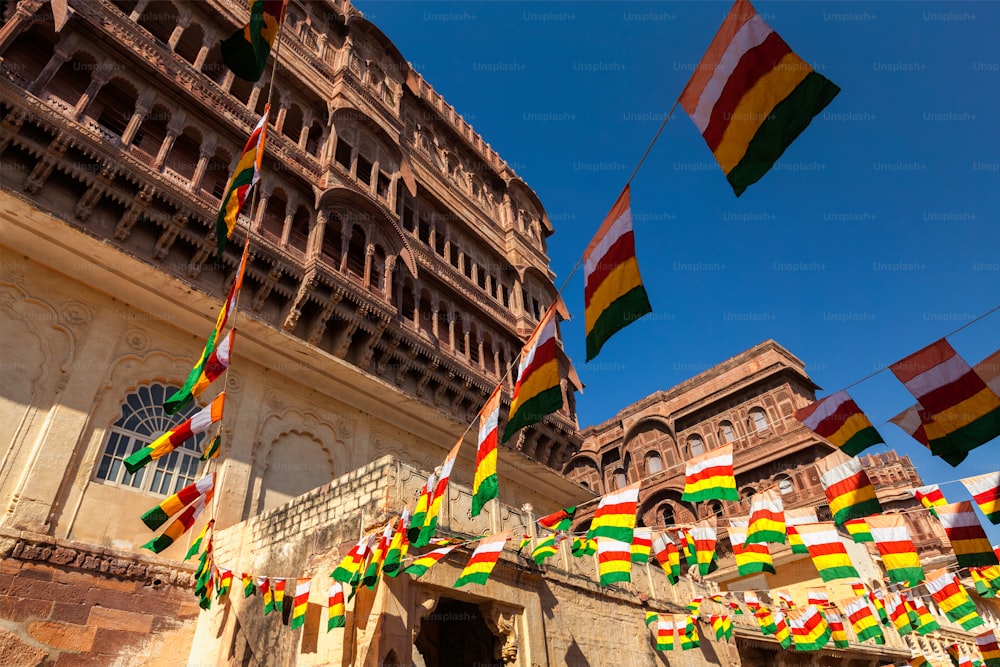 State flags of Jodhpur-Marwar in Meharngarh fort with blue sky. Jodhpur, Rajasthan, India