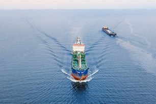 Cargo tanker with oil products floats on water in the Gulf of the North Seas, aerial view