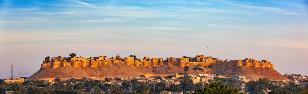 Panorama of Jaisalmer Fort - one of the largest forts in the world, known as the Golden Fort Sonar quila on sunrise. Jaisalmer, Rajasthan, India