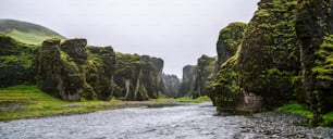 Unique landscape of Fjadrargljufur in Iceland. Top tourism destination. Fjadrargljufur Canyon is a massive canyon about 100 meters deep and about 2 kilometers long, located in South East of Iceland.