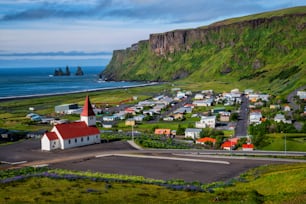 Beautiful town of Vik i Myrdal in Iceland in summer. The village of Vik  is the southernmost village in Iceland on the ring road around 180 km southeast of Reykjavík.