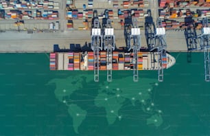 Aerial top view containers ship cargo business commercial trade logistic and transportation of international import export by container freight cargo ship in the open seaport