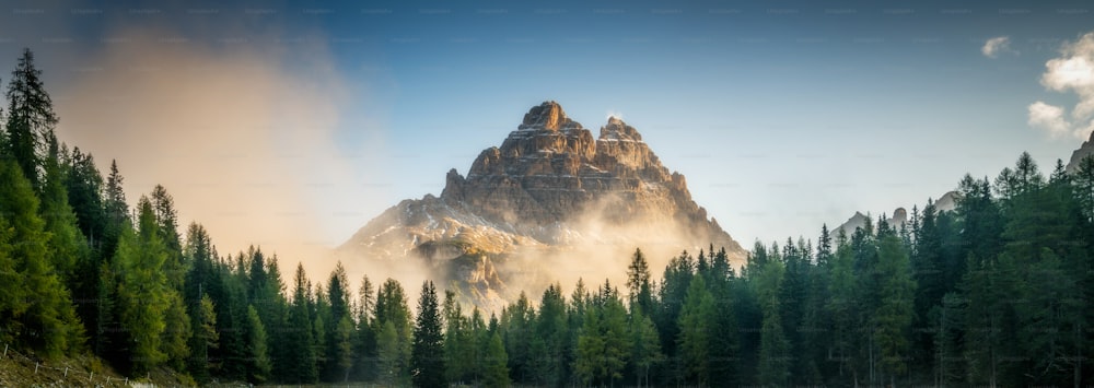 Forest and mountain range landscape in in Eastern Dolomites, Italy Europe. Beautiful nature scenery, hiking activity and scenic travel destination.