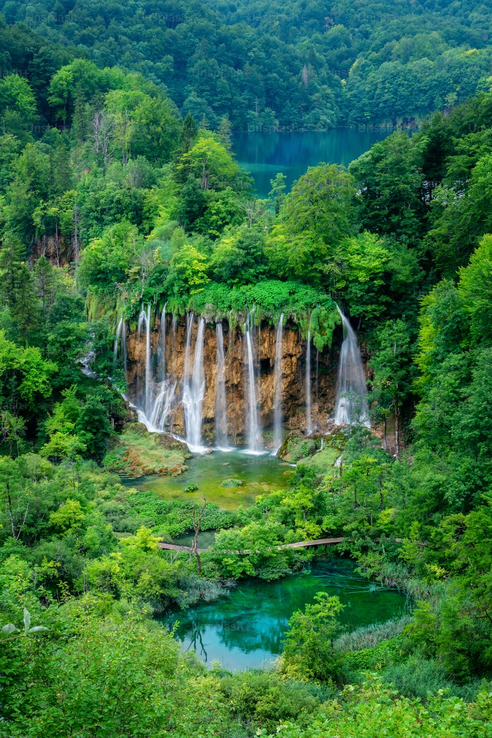 Exotic waterfall and lake landscape of Plitvice Lakes National Park, UNESCO natural world heritage and famous travel destination of Croatia. The lakes are located in central Croatia (Croatia proper).