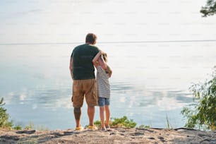 Father and daughter exploring new places together. Child girl and her daddy spending time together at the nature. Stock photo