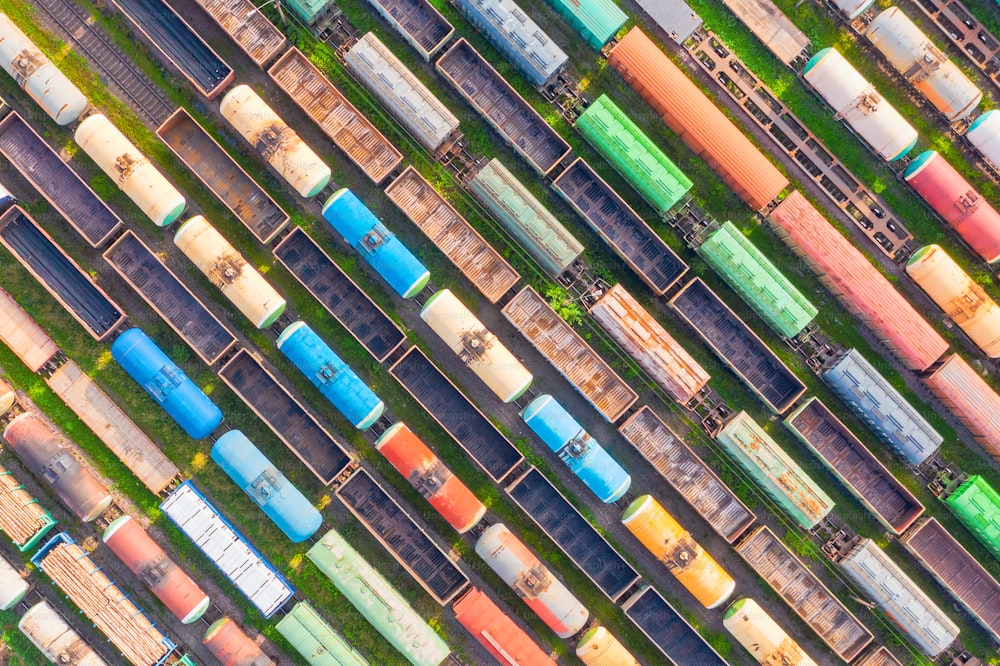 Freight cars with various raw materials - bulk, liquid, chemical industries, aerial top diagonal view