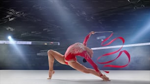 Rhythmic gymnast in professional arena.