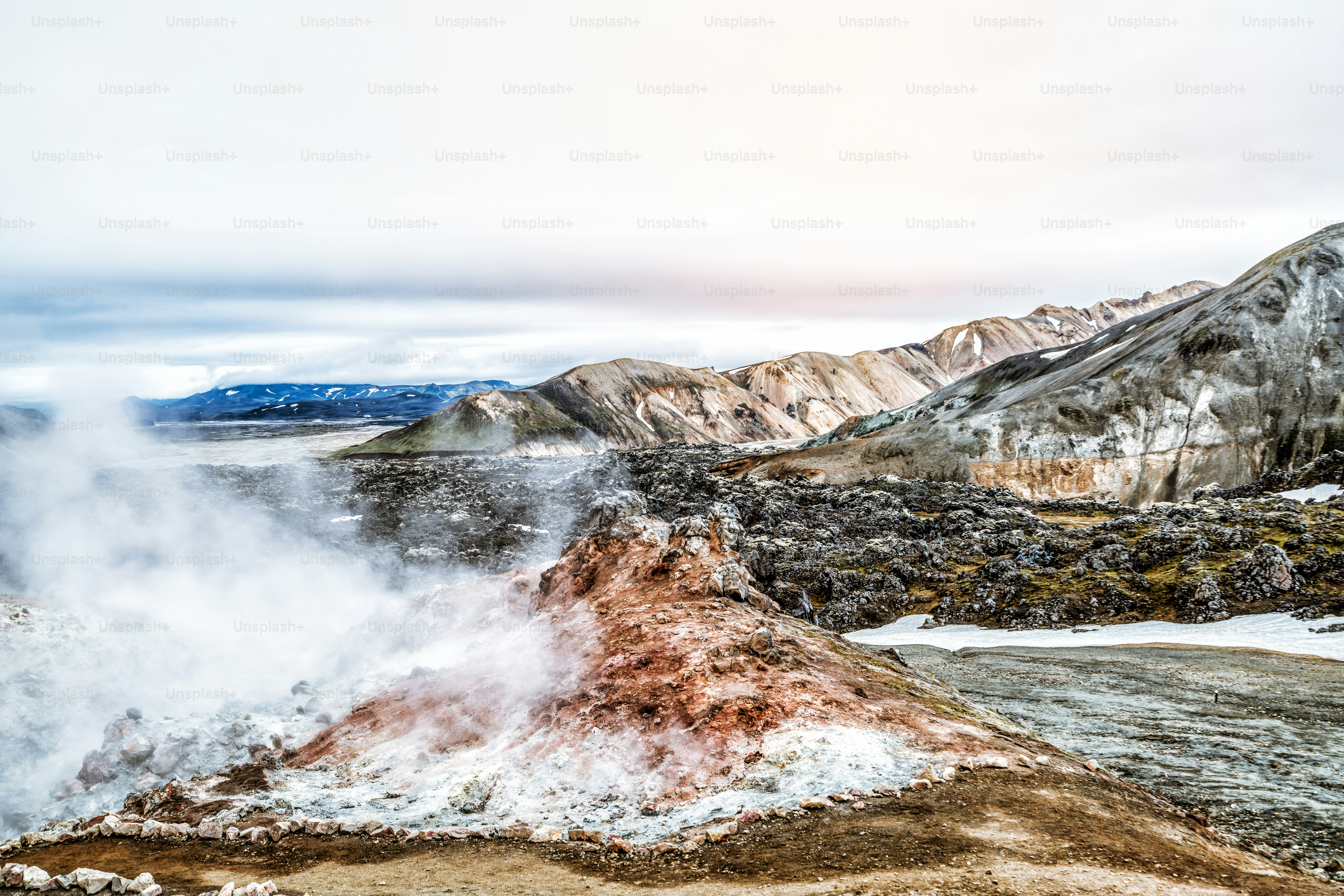 Landscape of Landmannalaugar surreal nature scenery in highland of Iceland, Nordic, Europe. Beautiful colorful snow mountain terrain famous for summer trekking adventure and outdoor walking.
