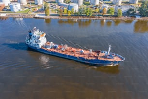 Aerial view tanker ship with liquid bulk cargo is sailing in channel water