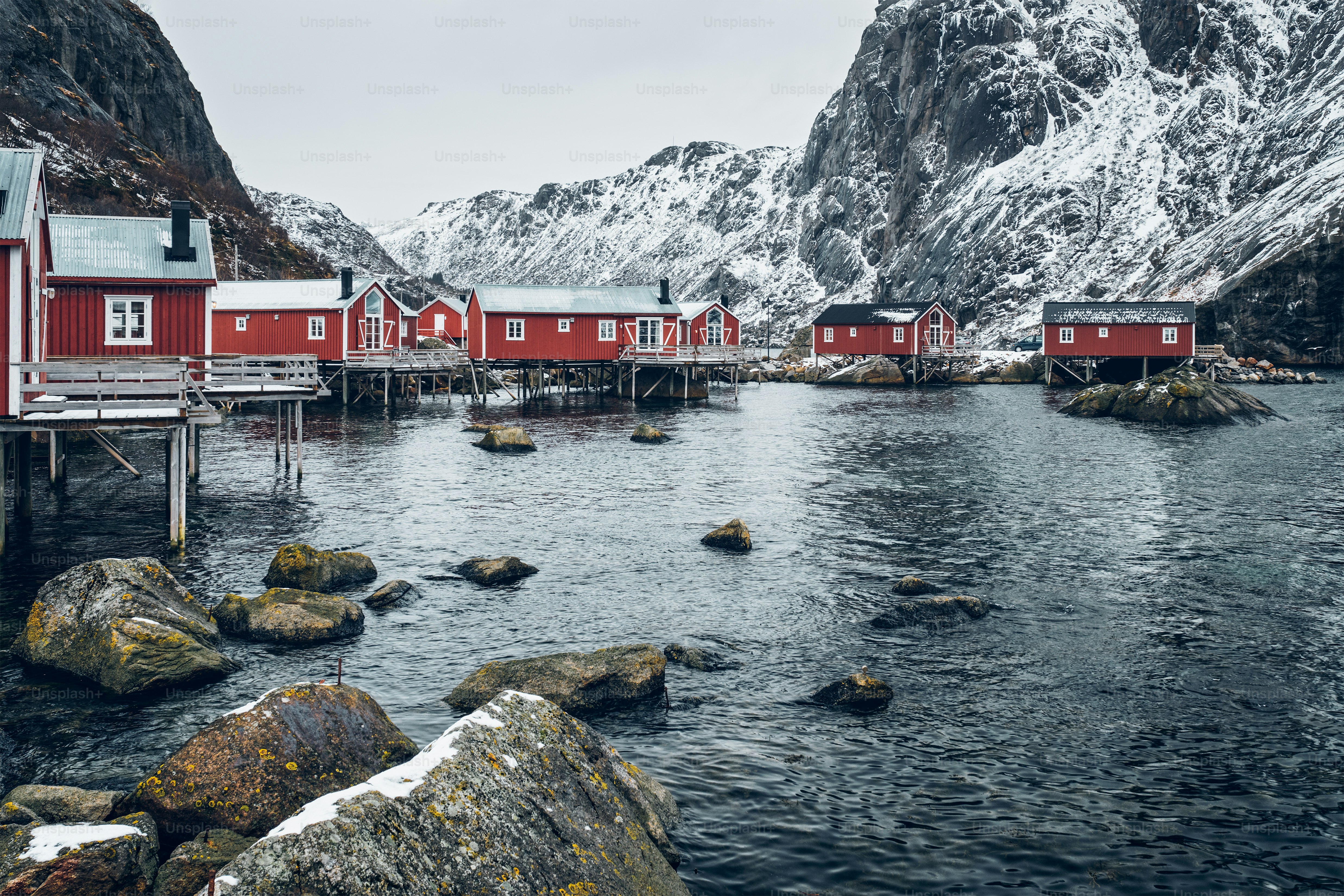 Nusfjord authentic traditional fishing village with traditional red rorbu houses in winter in Norwegian fjord. Lofoten islands, Norway