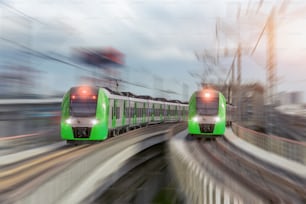 Two city passenger railway trains cross the bridge and turn at high speed