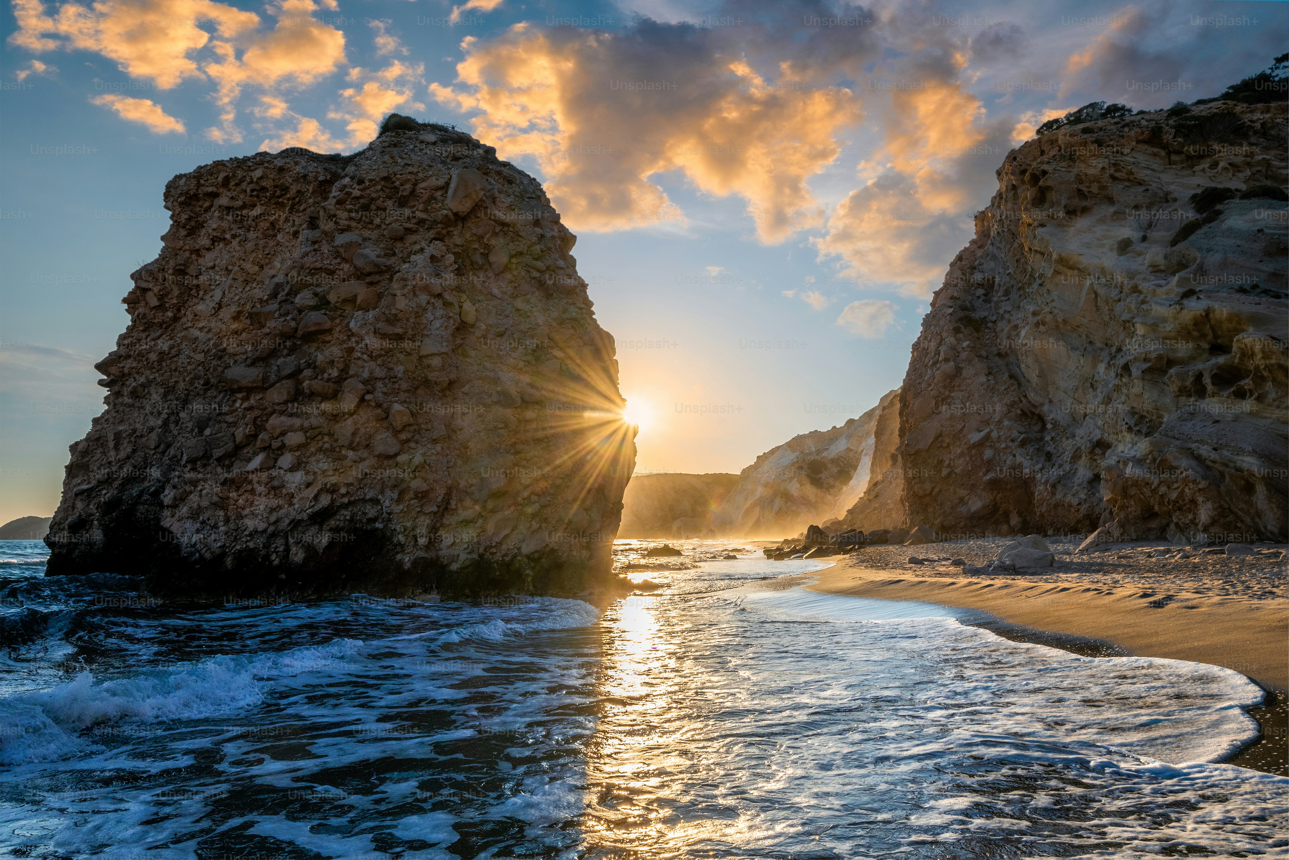 Fyriplaka beach and waves of Aegean sea on sunset, Milos island, Cyclades, Greece