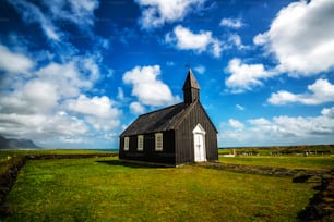 Budakirkja church in Snaefellsnes peninsula, Iceland. This black church sits alone in Budaahraun lava field, West of Iceland.