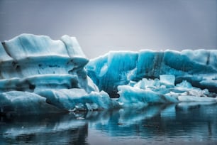 Icebergs in Jokulsarlon beautiful glacial lagoon in Iceland. Jokulsarlon is a famous travel destination in Vatnajokull National Park, southeast Iceland, Europe. Winter landscape.