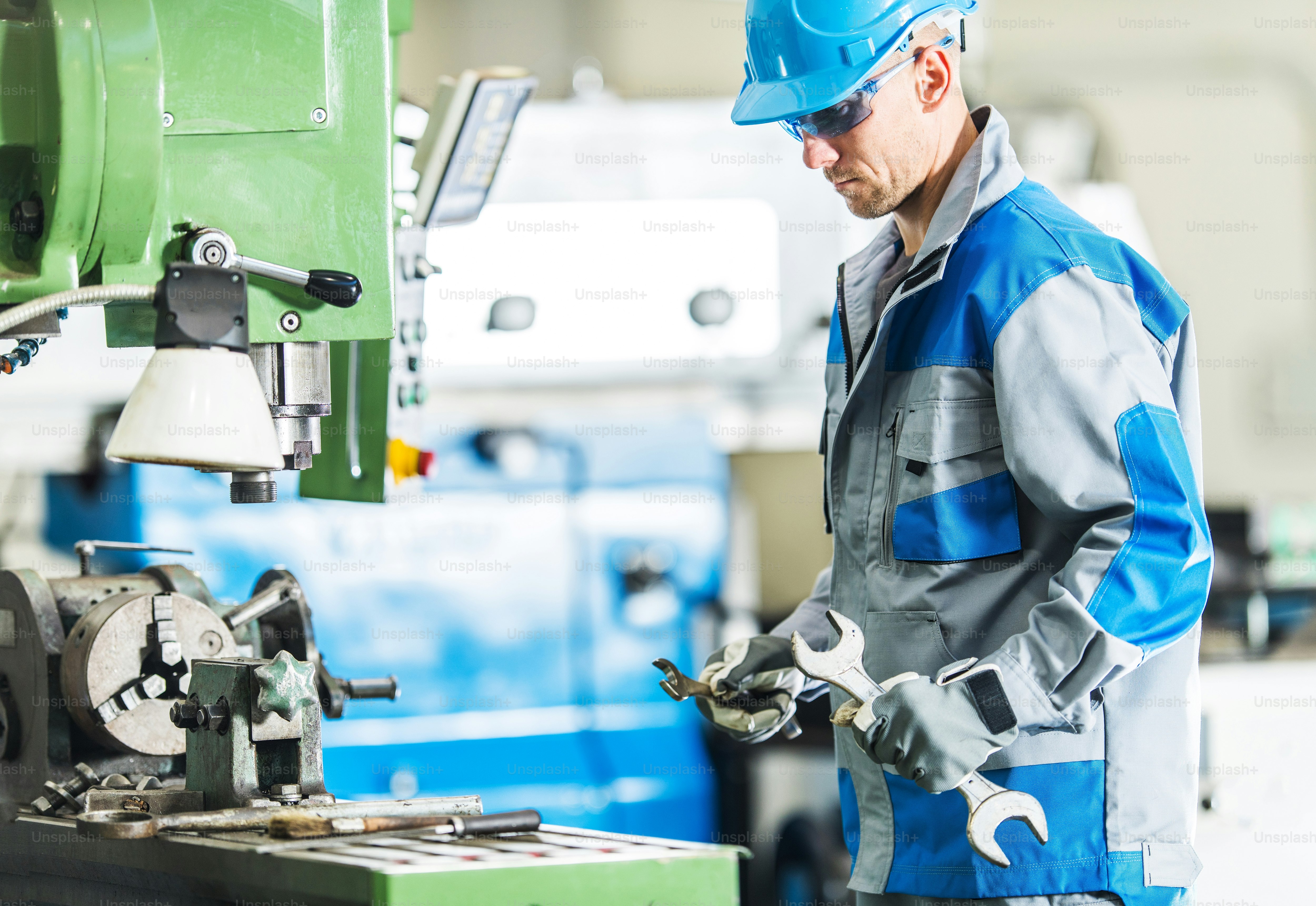 Metalworking Machines Mechanic. Caucasian Men with Large Wrenches Going ...
