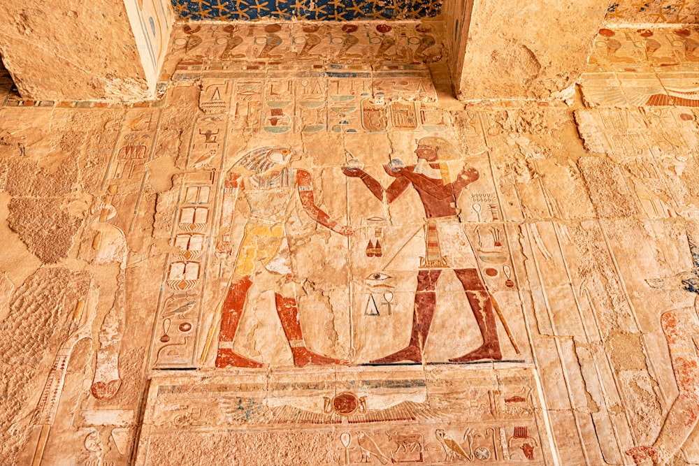 Egyptian wall murals and frescoes and paintings in Hatshepsut temple in Luxor. Religious mysteries and rituals in Egypt mythology and religion