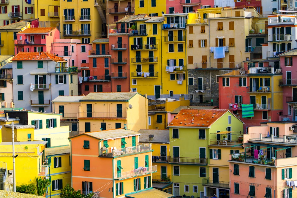 Colorful houses in Manarola Village, Cinque Terre Coast of Italy. Manarola is a beautiful small town in the province of La Spezia, Liguria, north of Italy and one of the five Cinque terre attractions.