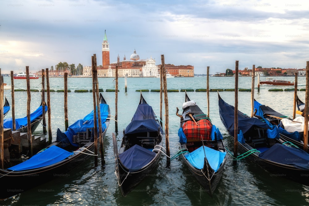 Gondolas in Venice, Italy from St Mark's Square (Piazza san Marco) with gorgeous view of San Giorgio Maggiore Church. Venice is famous travel destination of Italy for its unique cityscape and culture.