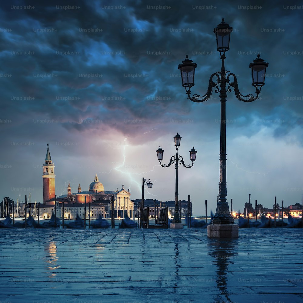 Gondolas floating in the Grand Canal on a rainy day