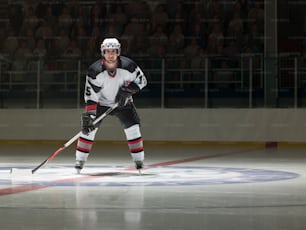 a hockey player on the ice with a stick