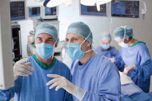 a group of doctors in scrubs and masks